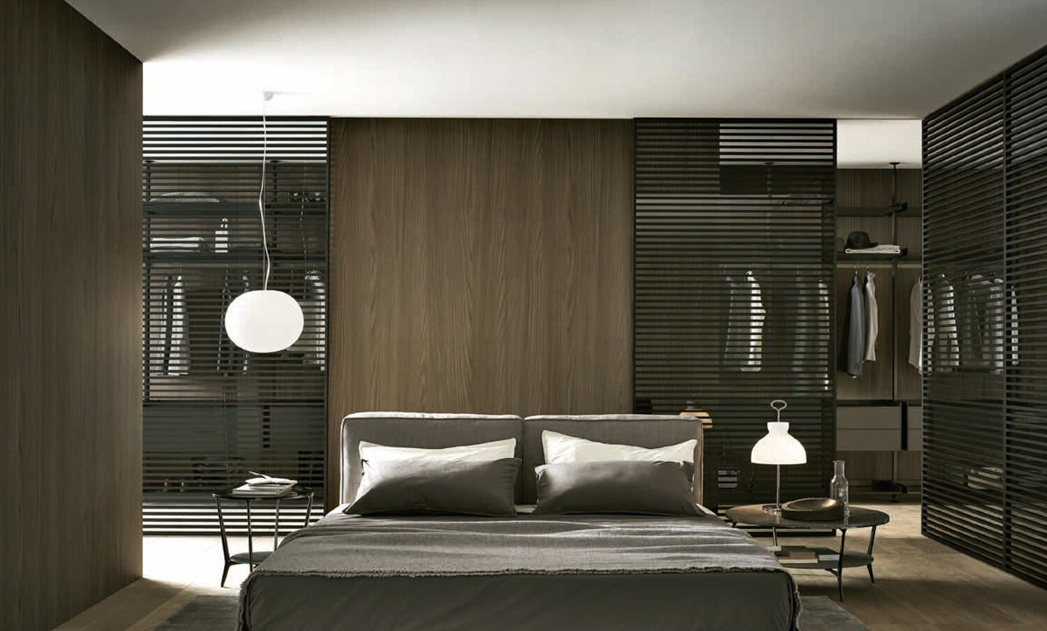 Rimadesio Stripe sliding doors framing a contemporary bedroom and dressing area with dark timber finishes