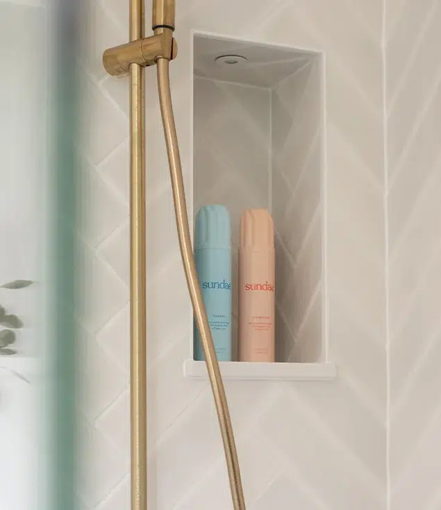 Brass and herringbone ensuite