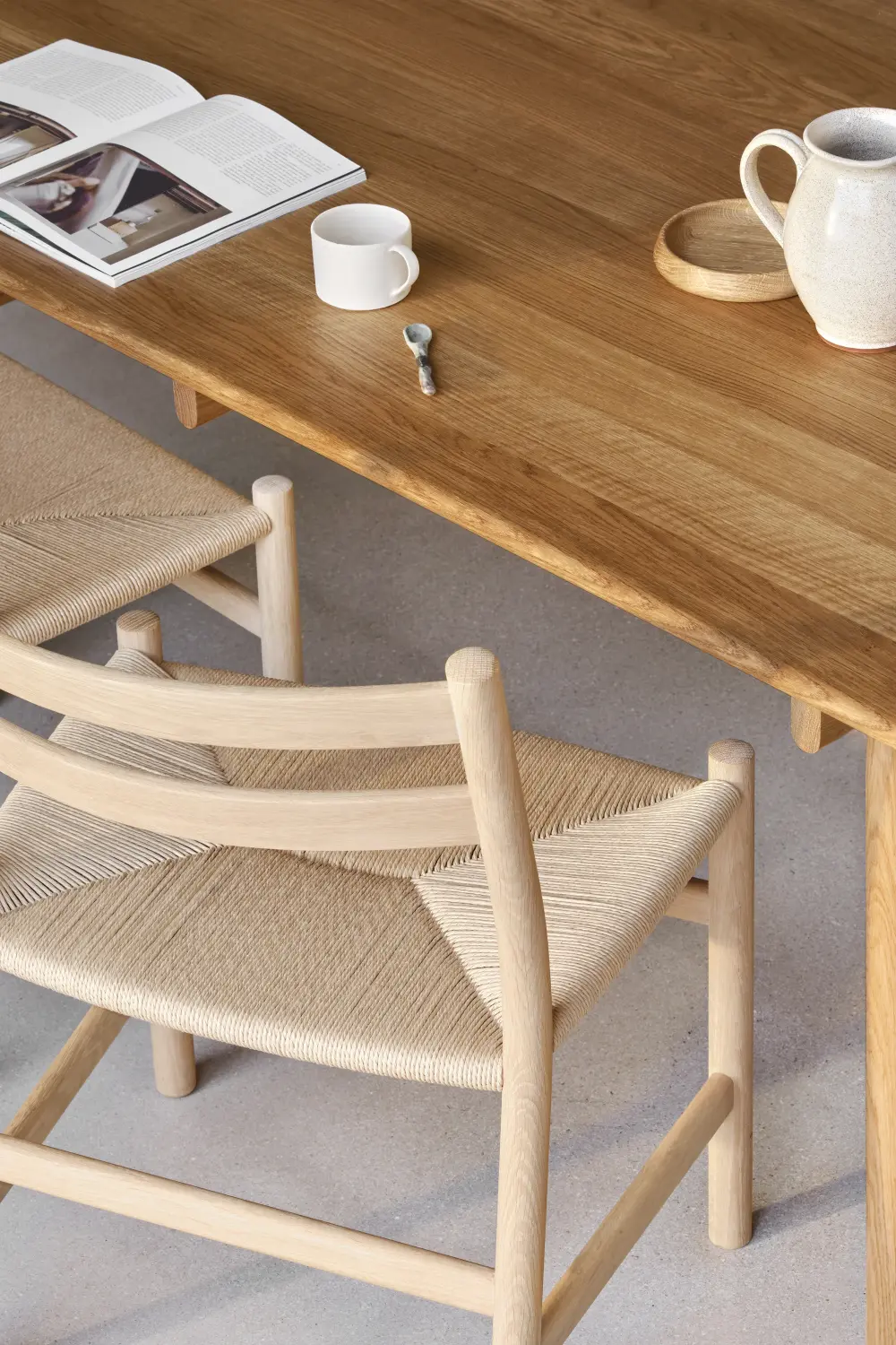 Carl Hansen & Søn dining chair and timber table showing the chair's curved wooden frame