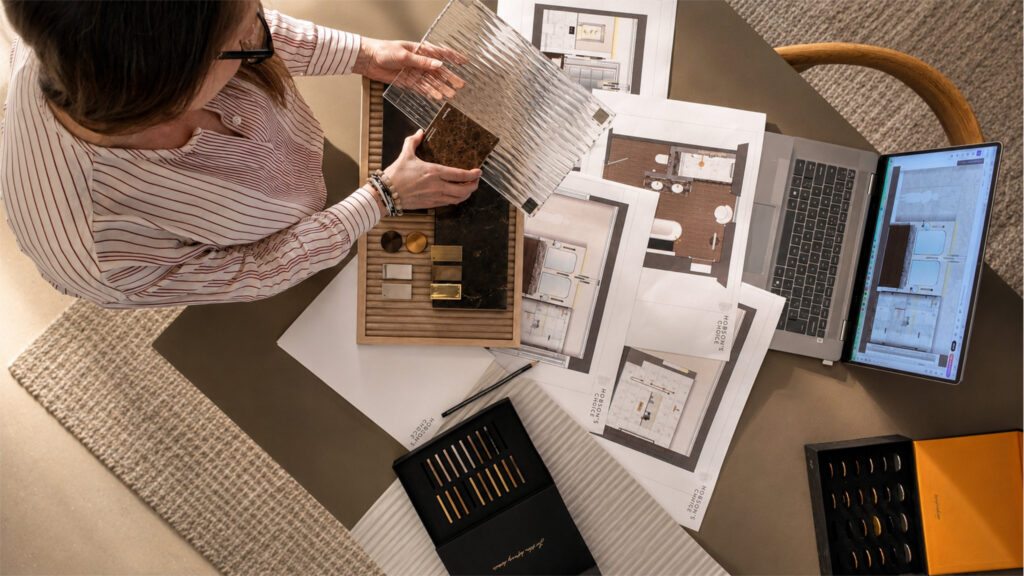 Hobson’s Choice designer reviewing bathroom material and finish samples
