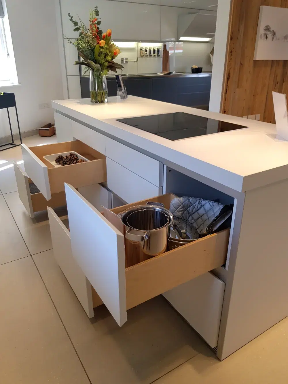 bulthaup b1 kitchen island with drawers open to show internal storage
