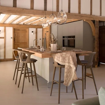 Contemporary kitchen within a rustic countryside home with timber beams and kitchen