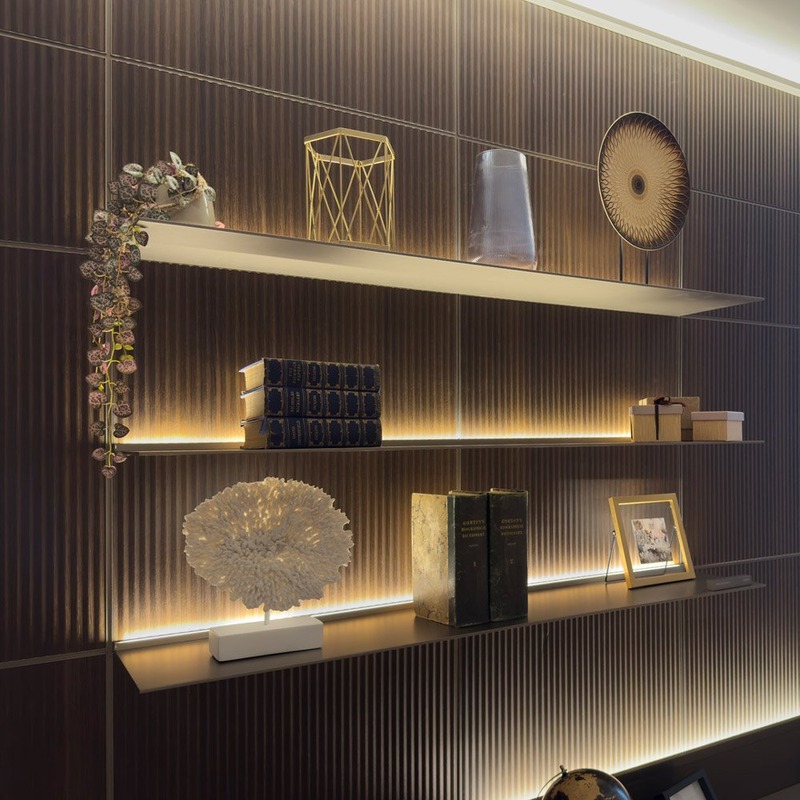 Rimadesio Modular dark wood wall panelling with integrated illuminated shelving
