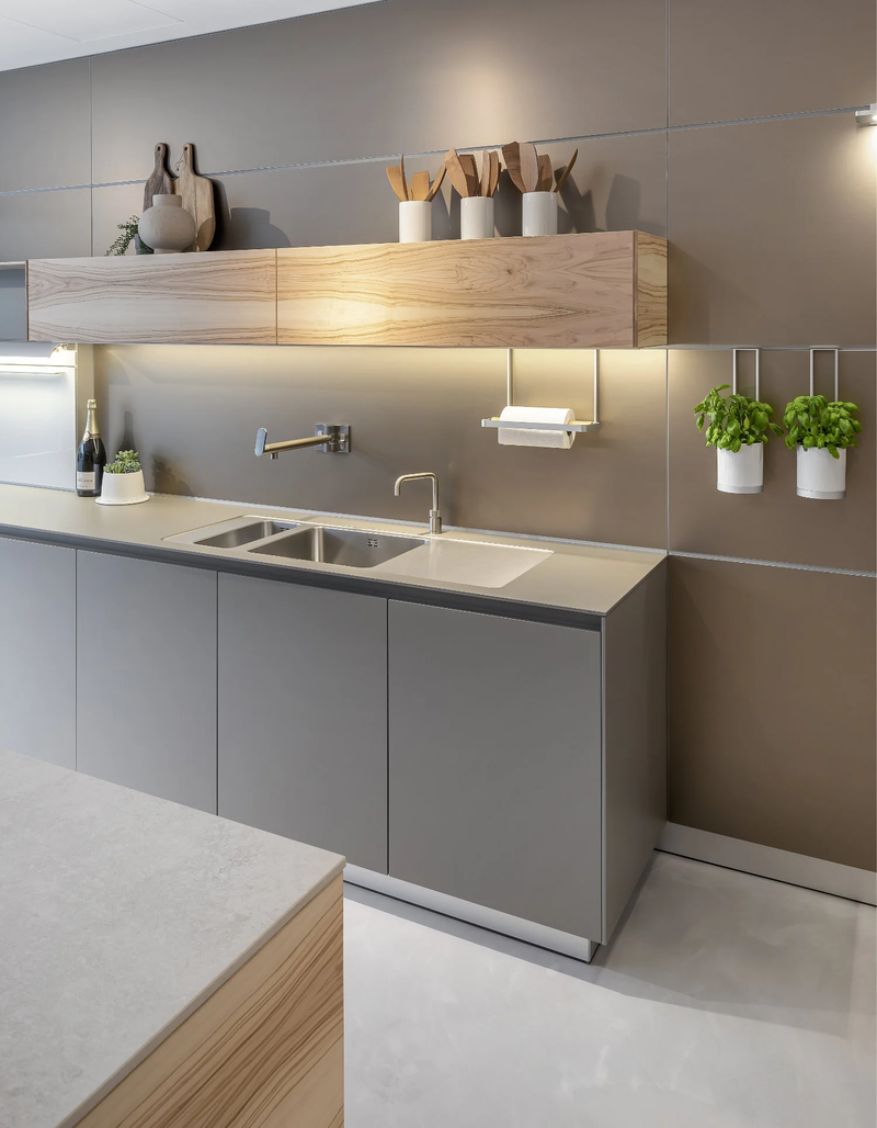 Winchester kitchen studio with a dark island, pendant lighting and dining chairs