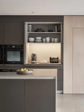 bulthaup kitchen with pocket door organisation system