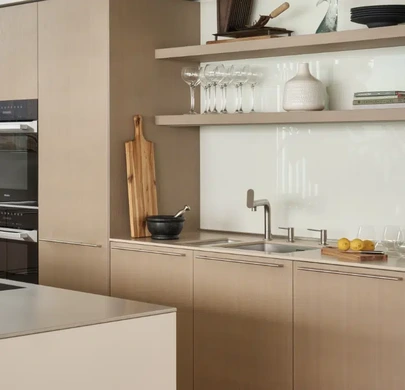 Grey Oak veneer cabinetry with Miele integrated ovens