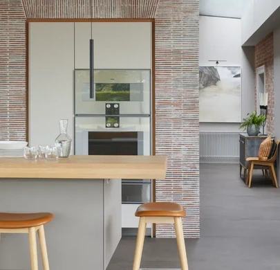 Gaggenau cooking appliances integrated into a creased tile feature wall