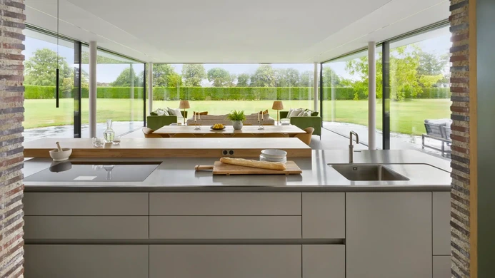 Open-plan kitchen and dining area within a modern glazed extension
