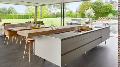 Historic home extension with contemporary kitchen and living space and panoramic garden glazing