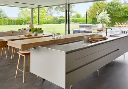 Historic home extension with contemporary kitchen and living space and panoramic garden glazing