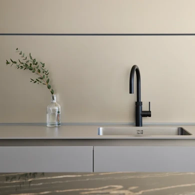 Matte black tap in ultra modern kitchen with bronze features