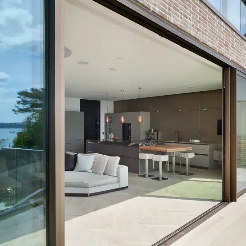 Open-plan kitchen with sliding glass doors connecting to the terrace