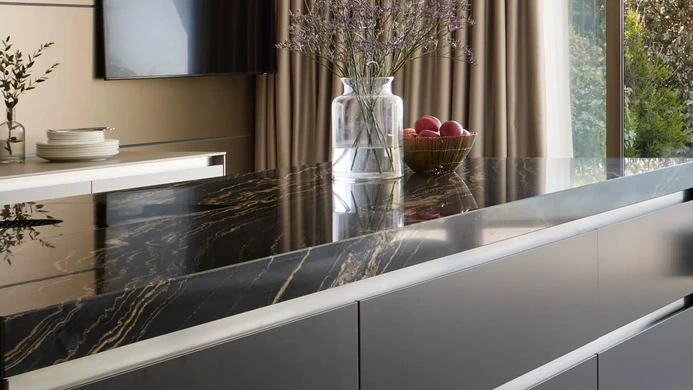 bulthaup kitchen with sand-beige panelling and quartz worktop