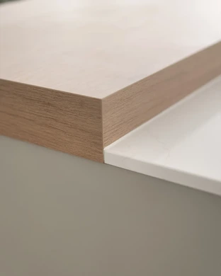Warm pale kitchen cabinetry paired with warm natural timber