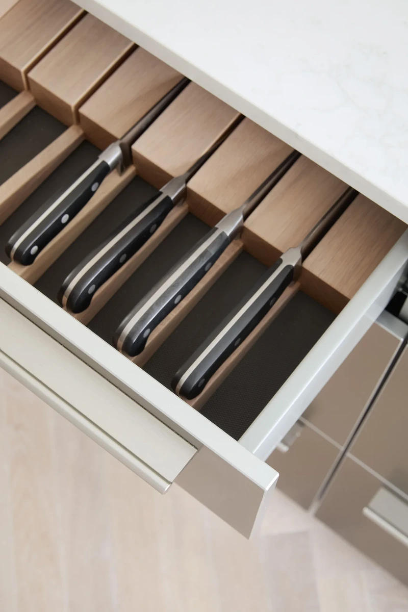 Bespoke cutlery drawer fitted within handleless kitchen cabinetry