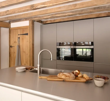 Side-by-side Miele ovens with wide storage drawer beneath