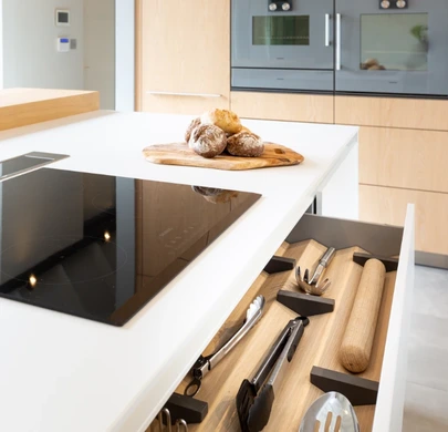 Minimal white kitchen worktop with integrated hob