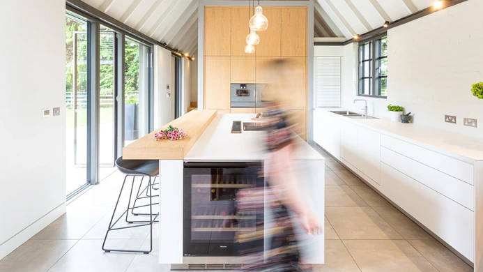 Bright kitchen with full-height glazed doors opening onto the garden
