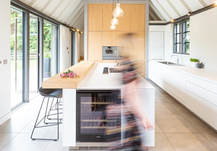 Bright kitchen with full-height glazed doors opening onto the garden