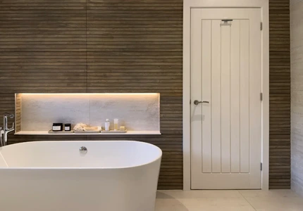 Minimalist master ensuite combining freestanding bath, vanity and shower