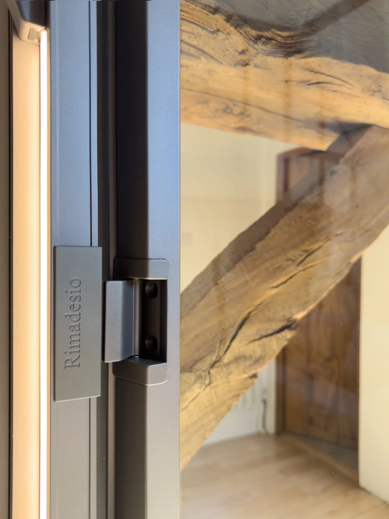 Smoked glass wardrobe doors with dark metal frames