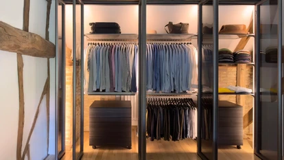 Luxury fitted wardrobe integrated into a characterful barn conversion