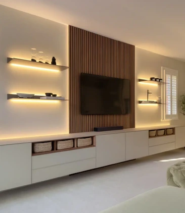Bespoke living room media wall with walnut detailing and integrated storage
