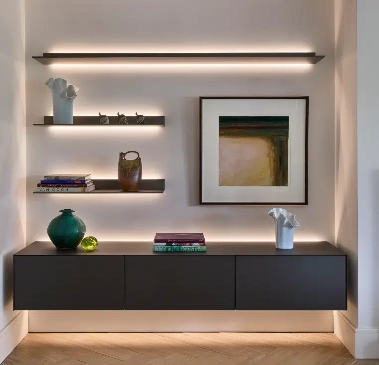 Minimal wall-mounted storage with integrated shelf lighting