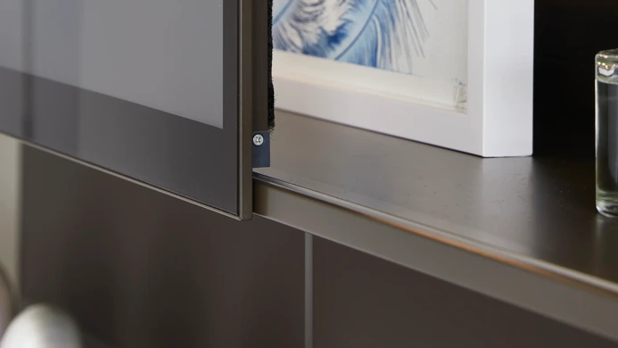 Sliding cabinetry on a wall hung media wall
