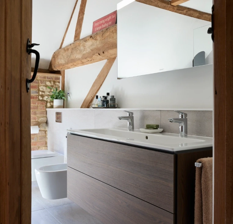 Bespoke double walnut vanity unit with mirrored storage