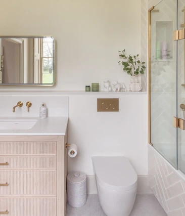Brass and Herringbone Ensuite