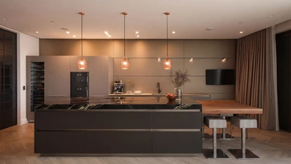 Bulthaup kitchen at night time stone worktop