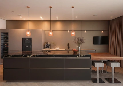 Bulthaup kitchen at night time stone worktop