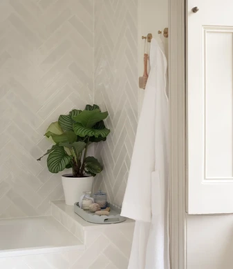 Brass and herringbone ensuite