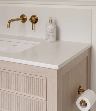 Brass and herringbone ensuite