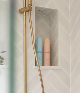 Brass and herringbone ensuite