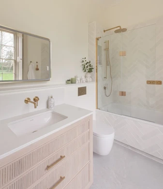 Brass and herringbone ensuite