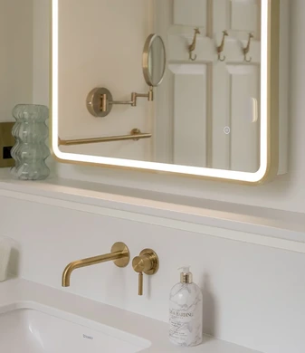 Brass and herringbone ensuite
