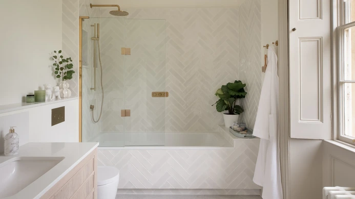 Brass and herringbone ensuite