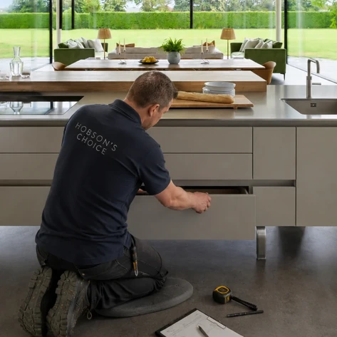 A Hobsons Choice Installer correcting a drawer alignment