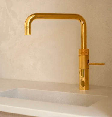 Gold-finished quooker tap in modern kitchen