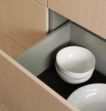 Open bulthaup b3 drawer showing organised internal kitchen storage
