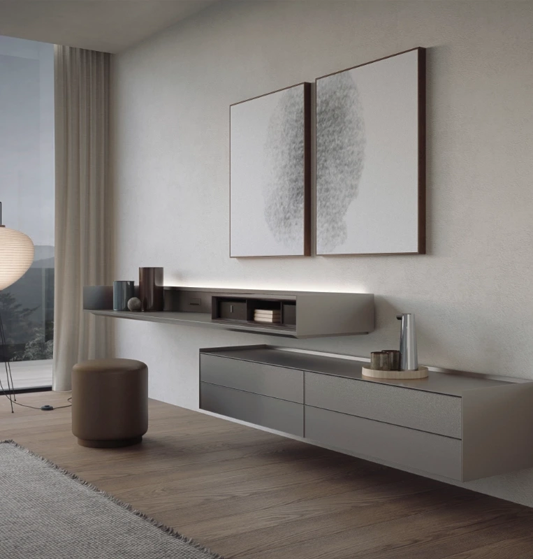 Wall-mounted Rimadesio Self sideboard in a pale finish beneath two artworks, with open shelf and drawer storage.