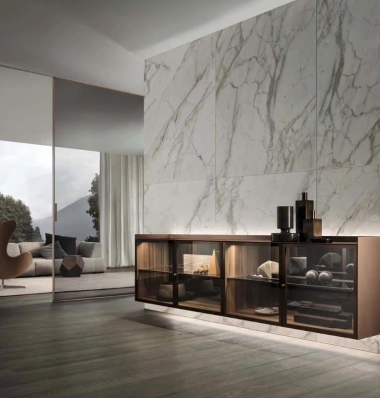 Rimadesio Self Bold sideboard with glass-fronted compartments, a marble top and integrated display lighting.