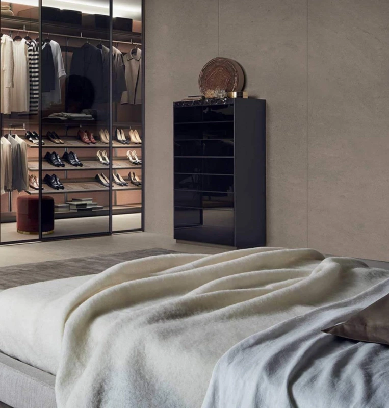Bedroom with Rimadesio Modular wall panelling beside illuminated wardrobe storage