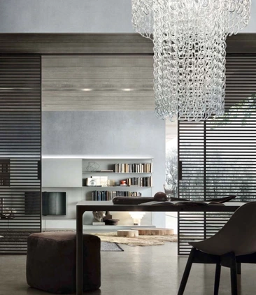 Rimadesio Stripe glass sliding doors dividing an open-plan interior