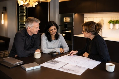 Hobson's Choice kitchen designer discussing kitchen plans with clients in Bath