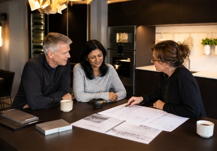 Hobson's Choice kitchen designer discussing kitchen plans with clients in Bath