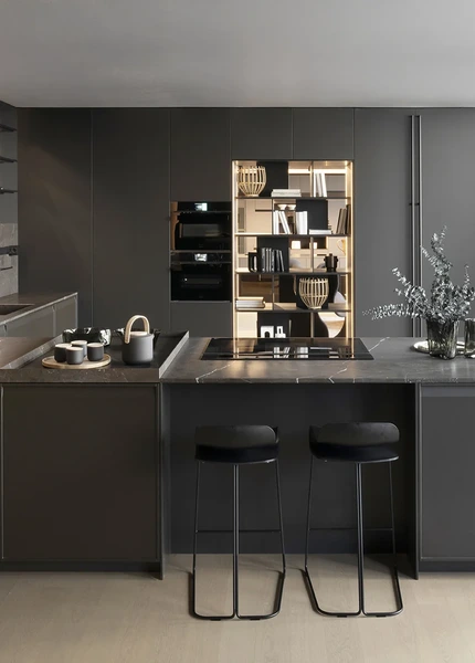 Large Arrital kitchen island with a dark worktop and dark cabinetry.