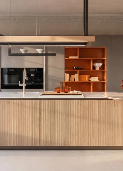 alt="light Arrital Kitchen against a large window and full-hight cabinetry"